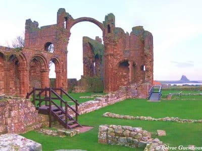 Lindisfarne Priory Ruins with Lindisfarne Castle in the background